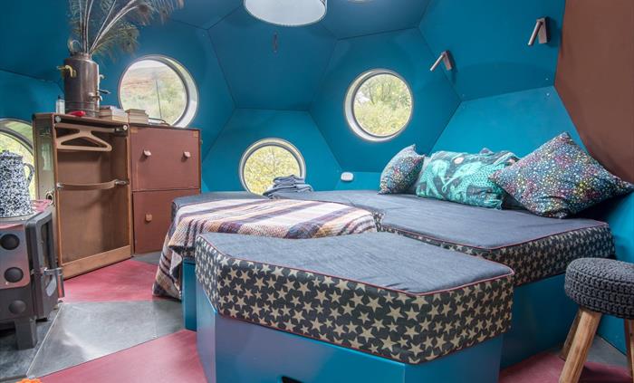 Interior - day, modular furniture doubles as a bed